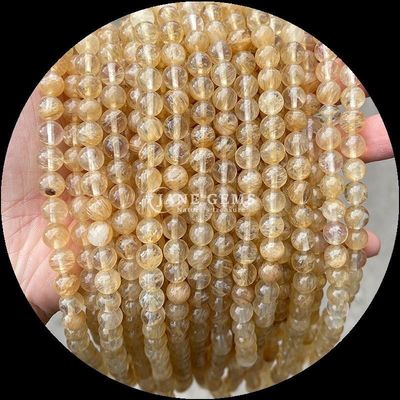 Yumuşatılmış mücevher taşları yuvarlak kesim ateş Kuvars Altın Rutilated Kuvars İnci iplikleri DIY Mücevher yapımı için